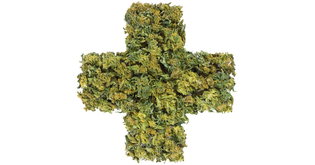 Medical Cross Symbol Made of Marijuana Flowers